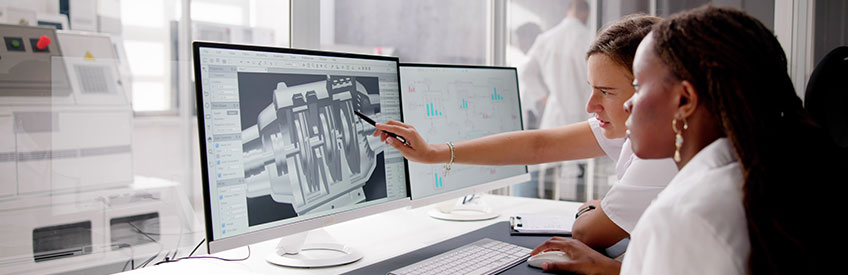 Engineer Doing 3D CAD Model Design On Computer At Factory