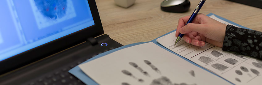 Student analyzing fingerprints 