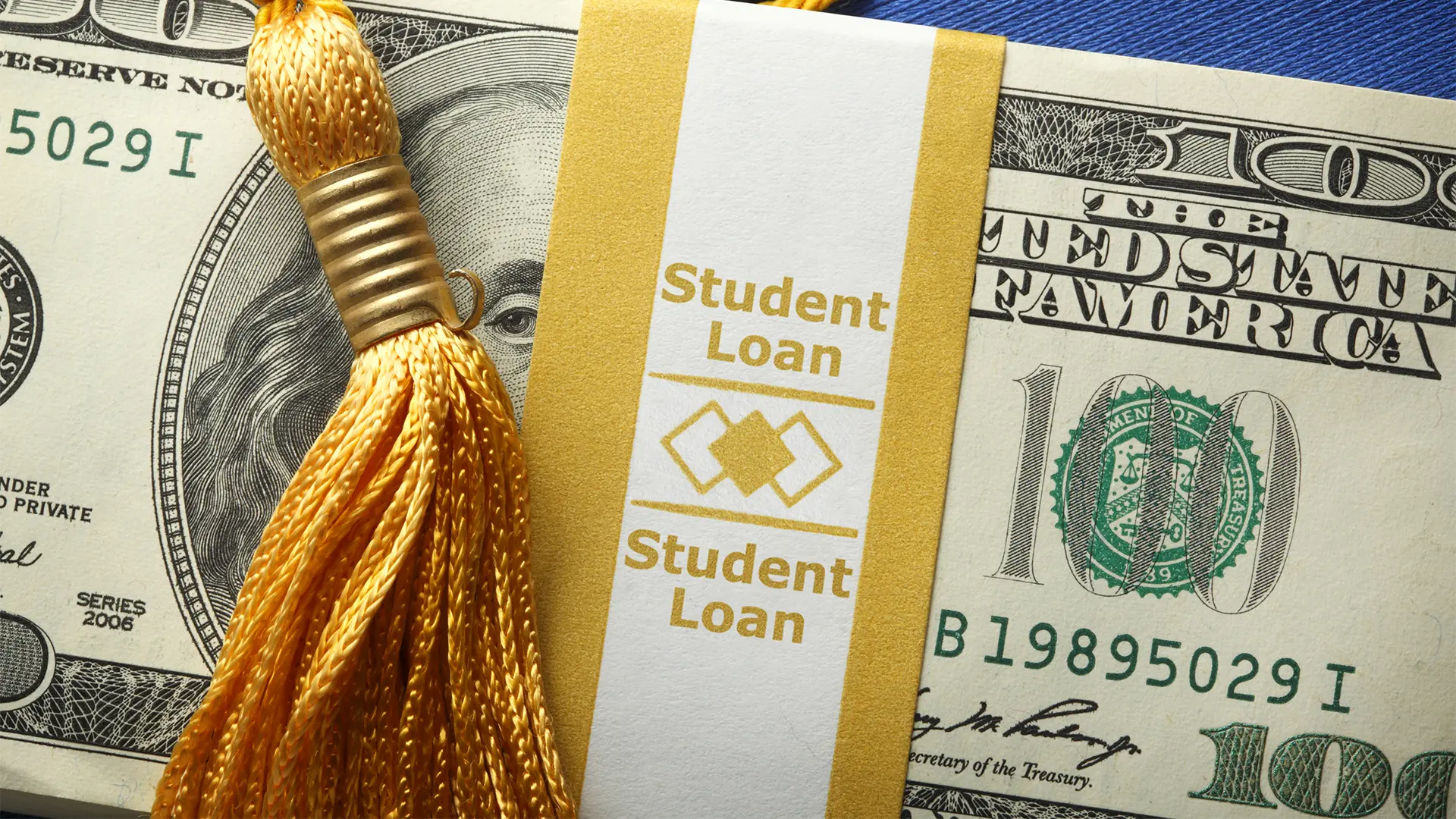 Band of money with student loans printed on band