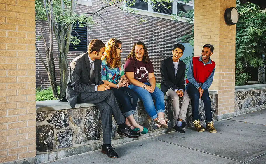 Group of students smiling on campus